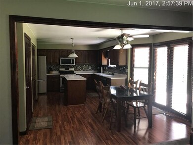 KITCHEN WITH FRENCH DOORS TO WALK OUT PATIO.