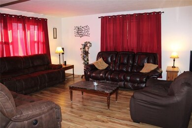 As you enter this home, the spacious living room i
