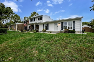 View of front of property featuring a front yard and a porch