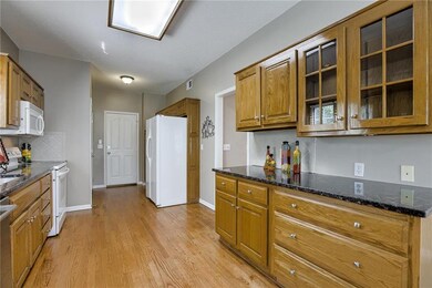 Kitchen has granite counters, lots of counter and 