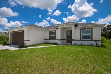 View of front facade featuring stucco siding, an a