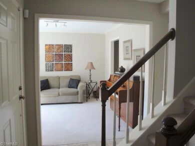 As you enter the home, to the left is the dining room currently staged as a music room.