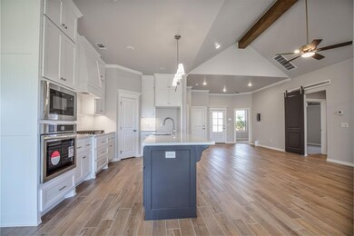 Kitchen with an island with sink, stainless steel 