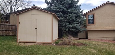 View of shed with fence
