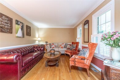 Living room featuring ornamental molding and light