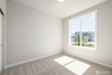 A view of some mountains from the front of this bedroom/office.