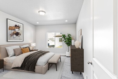 Carpeted bedroom with recessed lighting and a textured ceiling
