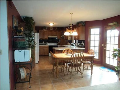 Shows Open dining and kitchen from living room (bu