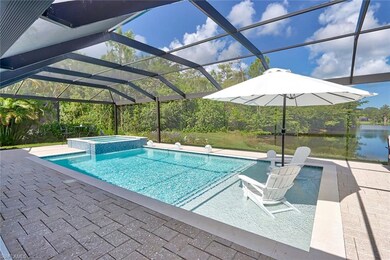 View of swimming pool featuring an in ground hot t