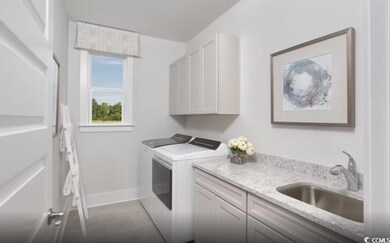 Laundry area with washer and clothes dryer and cabinet space