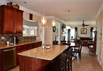 Open kitchen and family room. Crown molding throug