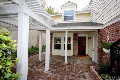 The gated brick front patio is a perfect place to 