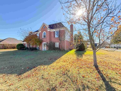 View of property exterior featuring a yard