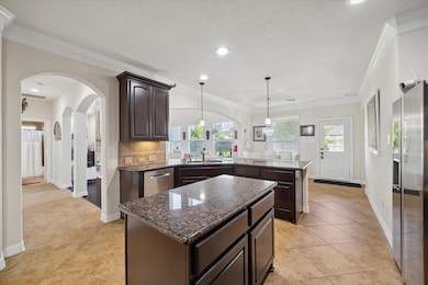 This kitchen features a spacious, open layout with