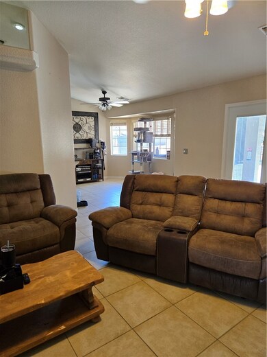 Living room featuring light tile patterned floors