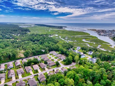 Aerial view of residential area featuring a large body of water
