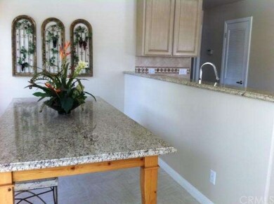 Granit table matches granite countertops throughou