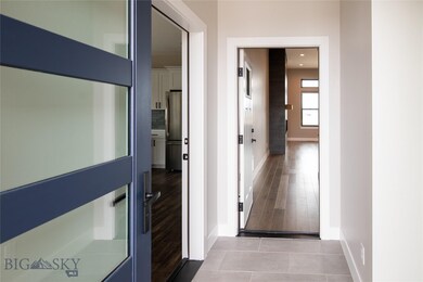 Entry with main house ahead and guest suite to lef