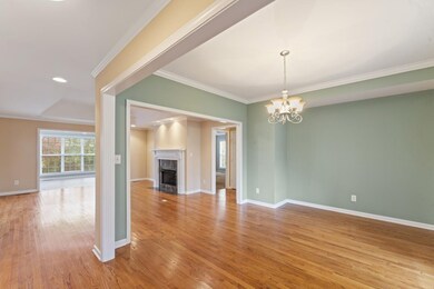 As you enter, there is a beautiful, open formal dining room. The original 3 bedroom plan was converted to a formal dining room. Dining room could be converted back to a third bedroom.