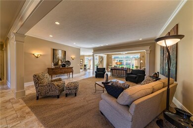 Great room is situated between formal dining room 