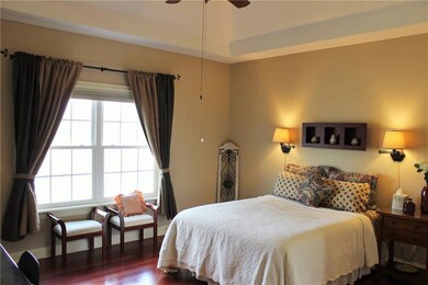 Bedroom 2 on the main is on the opposite side of that jack-n-jill bath connected to the office.  Bedroom two offers awesome views of the water, tray ceiling with fan/light, hardwood flooring, walk in closet and attached full bath.