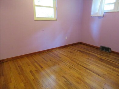 2nd bedroom with gleaming hardwood floors