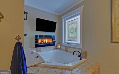 Primary Suite Tub w/ Fireplace