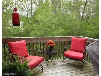 Patio/Deck. Spend your evenings relaxing on your private deck overlooking a lush wooded area!