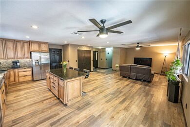 Kitchen featuring stainless steel fridge, ceiling