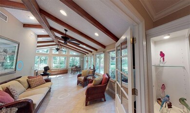Sunroom with cathedral ceiling