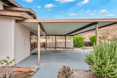 View of patio featuring a carport