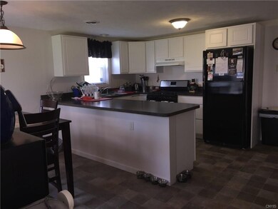 Kitchen features fresh white cabinetry keeping it 