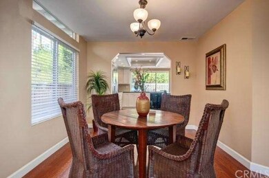 Expanded opening into kitchen make this dining are