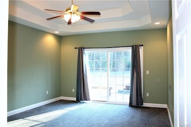 Master Bedroom w/ sliding glass doors to the rear deck.