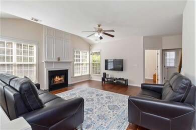 Living area with dark wood finished floors, ceilin