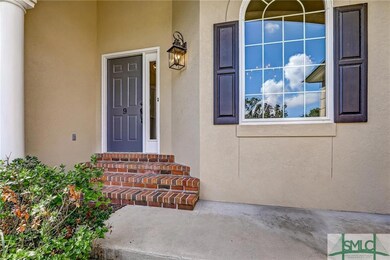 The front porch has a few steps to get into the ho