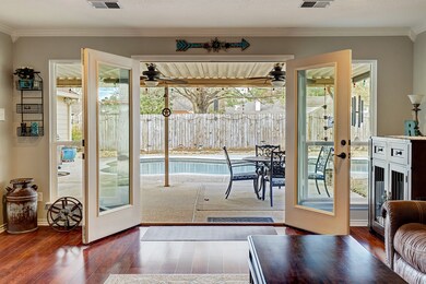 Enjoy a seamless connection between indoors and outdoors in the impressive family room, boasting elegant French doors opening to the covered patio and fenced backyard. Even while the doors are closed, this beautiful design choice allows for natural light to flood the home.