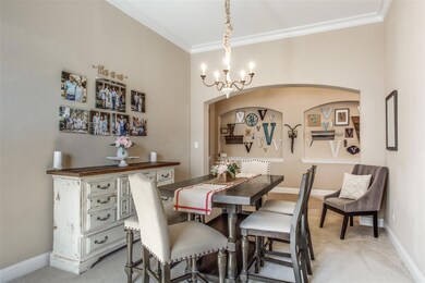 The dining room passes from foyer to kitchen. Ready for gatherings.