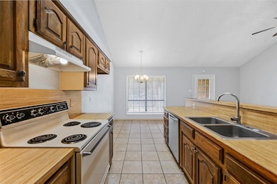 Kitchen featuring white electric range oven, light