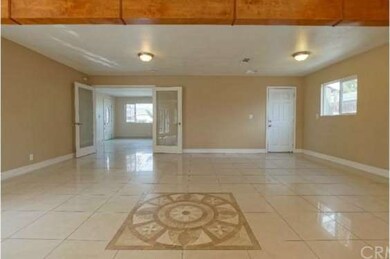 Family room area with double door entry and coat c