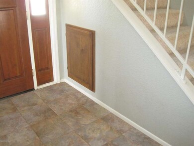Storage space under stairs @front entry