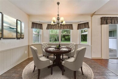Breakfast area with virtually staged furniture.