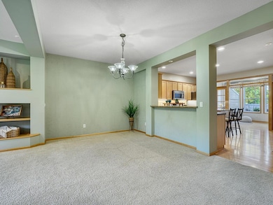 Open to the kitchen through a convenient pass-through, perfect for serving meals while keeping you connected with friends and family.