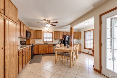 Huge Eat-in Kitchen with custom cabinetry and plen
