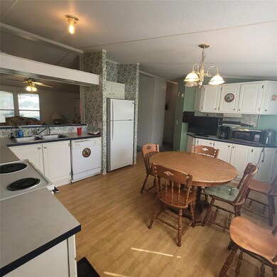 Dining space with light wood-style floors, a ceil