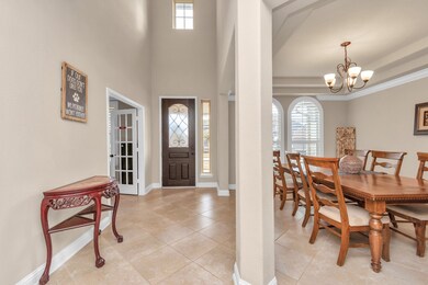 View of the front door and formal dining w/ study entrance