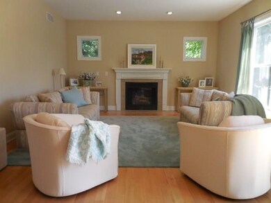 The living room features the hardwood floors, gas 