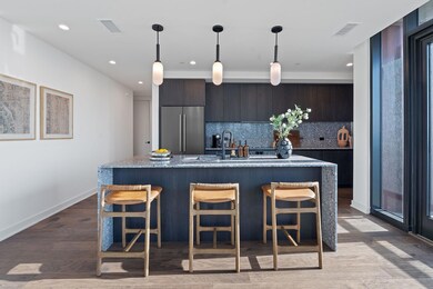 Kitchen with stainless steel fridge, tasteful bac