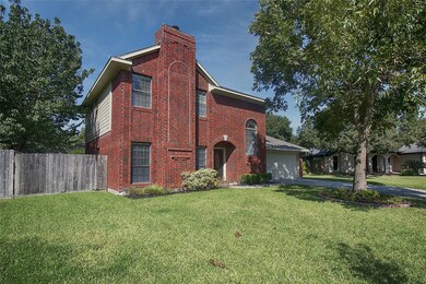 A mature tree and beautiful landscaping give this home great curb appeal.