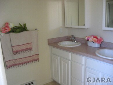 Master Bath has walk in shower with benches, doubl